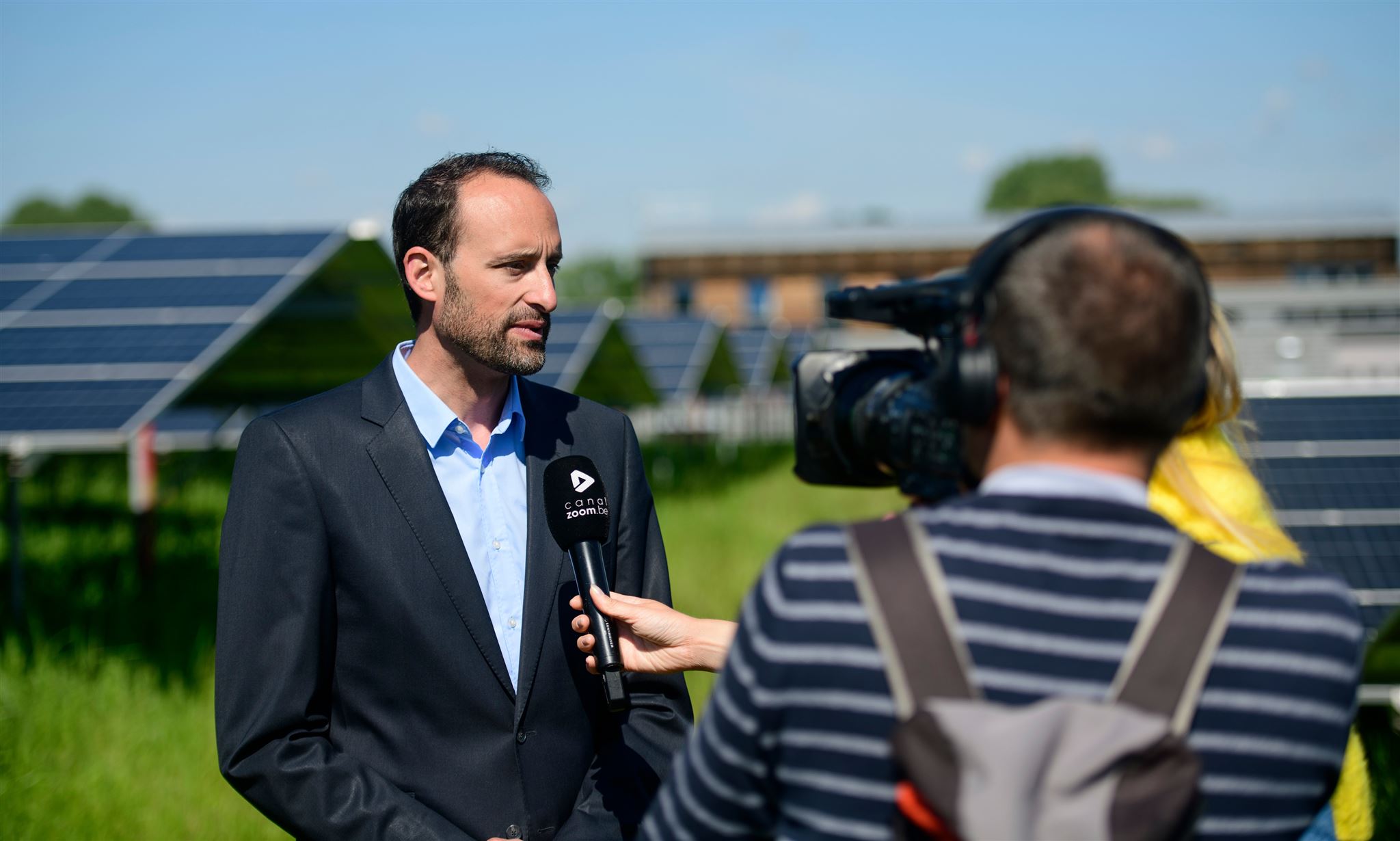 Nicolas Coppée in front of the solar panels at Gembloux